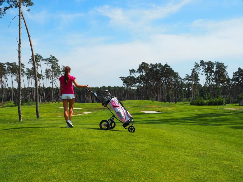 Girl Golfing and Walking with Bag Cart